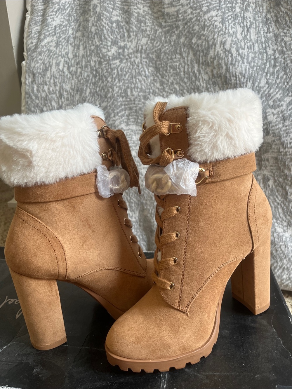 Caramel combat boots with white faux fur